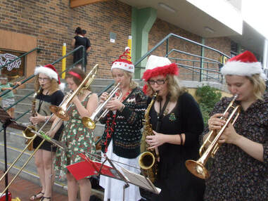 Busking to promote the Christmas concert, 2009